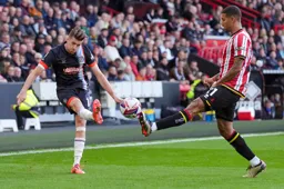 Reece Burke`s attempted cross is blocked