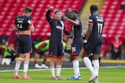 Alfie Doughty and Teden Mengi in deep discussion