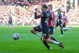 Alfie Doughty tussles for the ball against Alfie Gilchrist
