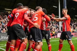 Happy bunch of Hatters celebrate following the first goal