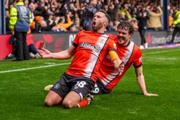 Jordan Clark and Tom Holmes celebrate Clark`s goal with a knee slide
