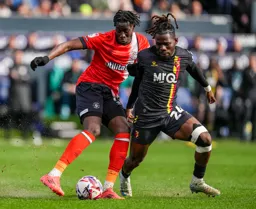 Elijah Adebayo comes under pressure from Dele-Bashiru