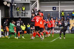 Elijah Adebayo competes for a high ball against Vakoun Bayo
