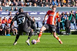 Reece Burke runs into Edo Kayembe
