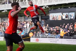 Carlton Morris leaps with delight after scoring the second goal