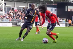 Tahith Chong takes the away from Edo Kayembe