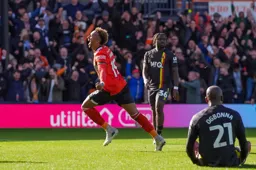 Jacob Brown wheels away in delight after scoring the third goal