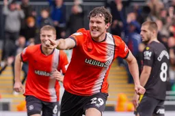 Tom Holmes looks happy as the Town go 1-0 in front
