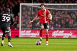 Tom Holmes puts his foot on the ball