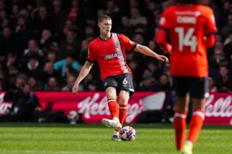 Mark McGuinness plays a sidefoot pass