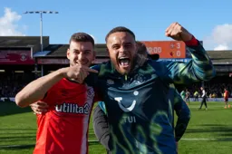 Tom Krauss and Carlton Morris show their delight after the game