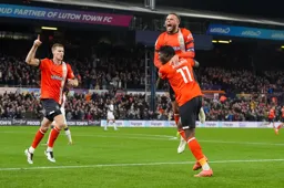 Elijah Adebayo gives Carlton Morris a lift after Adebayo had levelled the score