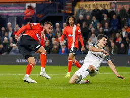 Carlton Morris attempts a shot at goal