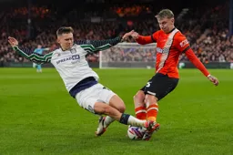 Alfie Doughty is on the recieving of a strong tackle