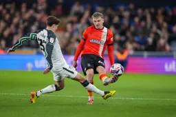 Alfie Doughty lifts the ball past Trai Hume