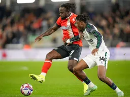 Victor Moses goes for the ball against Romaine Mundle