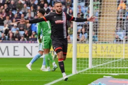 Carlton Morris celebrates scoring from the penalty spot