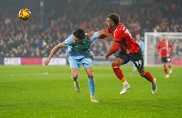 Jacob Brown gets in a header despite Perry Ng`s efforts