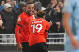 Carlton Morris celebrates with goalscorer Jacob Brown