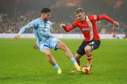 Alfie Doughty dribbles the ball past the Bluebirds defender