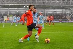 Jacob Brown attempts to shake off his marker