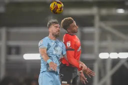 Jacob Brown goes up for a heading duel