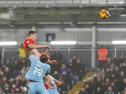 Mark McGuinness gets in a towering header against his former colleagues