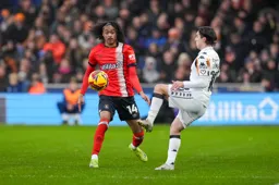 Tahith Chong looks on as Abdulkadir Omur controls the ball