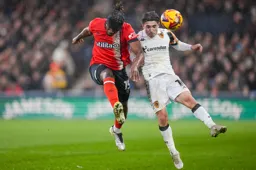 Teden Mengi shows aggresion as he goes in with a header