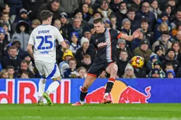 Reece Burke and Sam Byram look for the loose ball