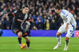 Daiki Hashioka looks for a way past Max Wober