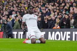Elijah Adebayo celebrates his goal with a knee slide