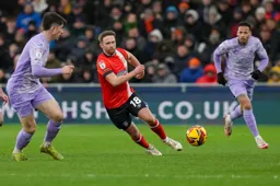 Jordan Clark leans towards the ball