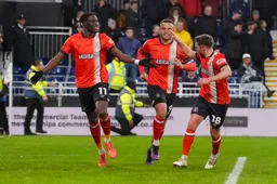 Elijah Adebayo celebrates his goal along with Carlton Morris and Jordan Clark