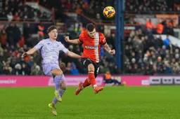 Tom Krauss leaps in to head the ball
