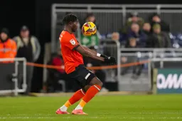 Elijah Adebayo cushions the ball