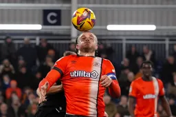 Carlton Morris cushions the ball