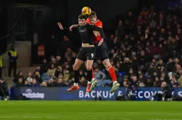 Mark McGuinness beats Tom Cannon to the ball