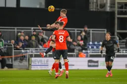 Mark McGuinness heads the ball clear