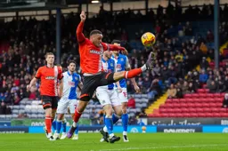 Carlton Morris stretches for the ball