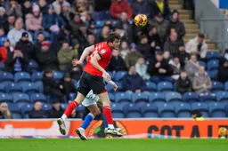 Tom Holmes wins his header