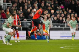Elijah Adebayo controls the ball in mid-air