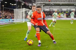 Carlton Morris shields the ball