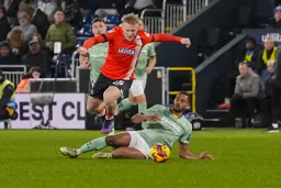 Joe Taylor hurdles the Rams defender