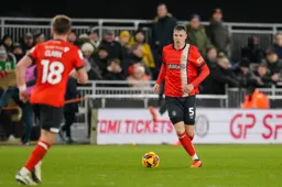 Mads Andersen looks to lay the ball off
