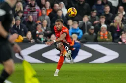 Jacob Brown plays the ball forward