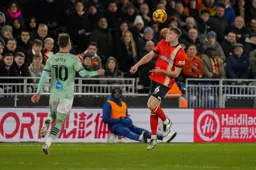 Mark McGuinness heads the ball forward
