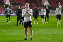 Joe Taylor applauds the away fans