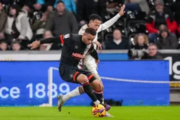 Carlton Morris wins this battle