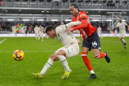 Tahith Chong wrestles for the ball